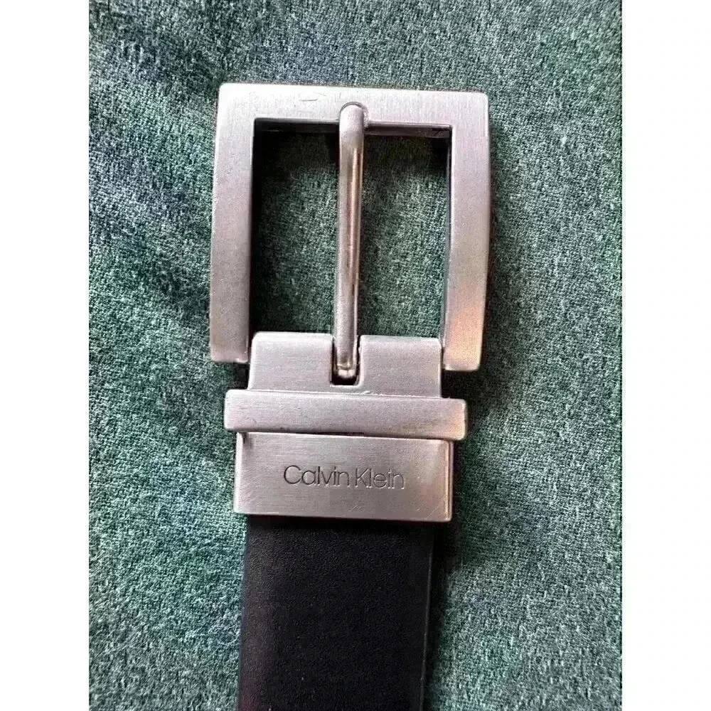 Calvin Klein black leather belt 42” x 1” wide brushed silver tone hardware